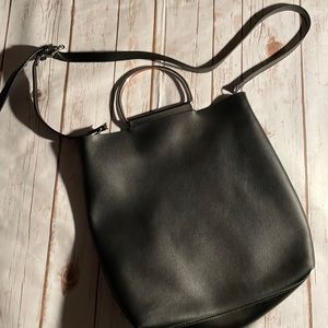 Women’s leather purse with long strap and metal handles